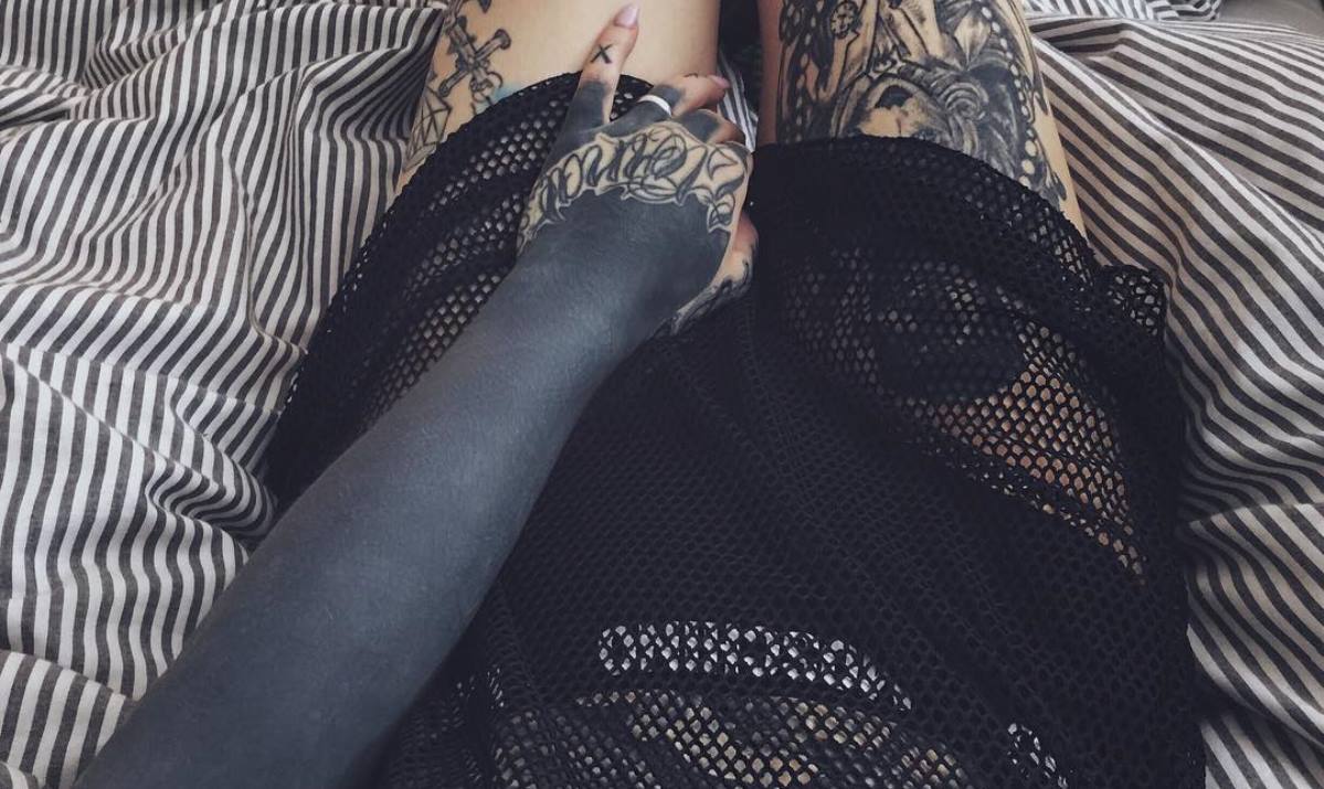 blackout tattoo covering full arm