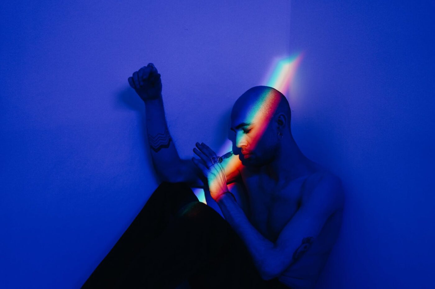 man in shadow and rainbow