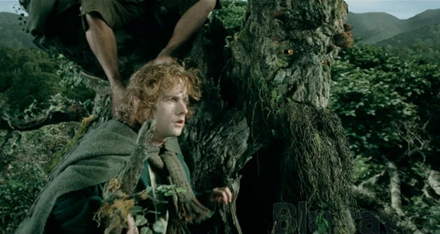 Treebeard carrying hobbits
