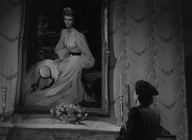 miss holloway stares at mary's portrait