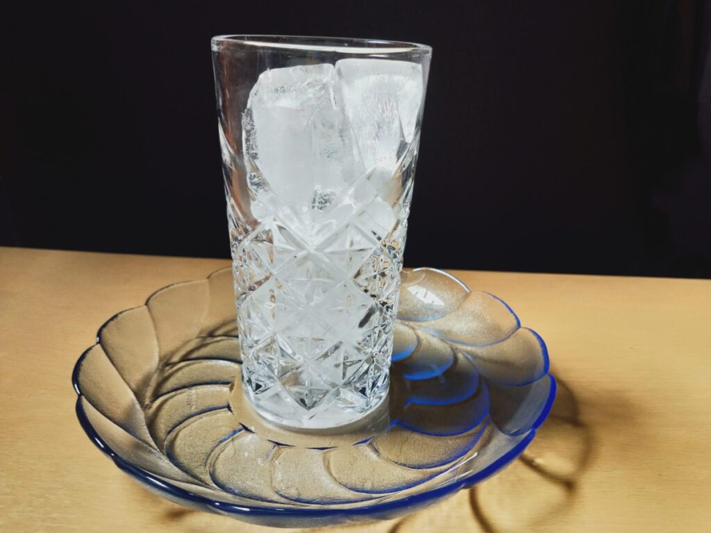 Add ice to wolf hook juice glass